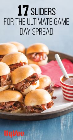 several sliders on a plate with dipping sauce in the middle and text overlay that reads, 17 slides for the ultimate game day spread