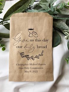 a brown paper bag with the words give us this day our daily bread