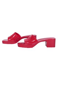 Create sizzling summer looks with these red-hot rubber sandals from Gucci. Playfully chic, these square-toe slide sandals are boosted by a waved platform and chunky heel. A wide, glossy band with raised logo lettering adds a touch of quiet luxury to these must-have shoes. Perfect for pool parties and warm-weather adventures! Size 10 (EU 40) Rubber Slip-on Logo strap Block heel Square toe Heel height 2.25" Platform height .75" Gucci Block Heels For Summer, Summer Beach Slides With Padded Heel, Trendy Sandals With Block Heel And Red Sole, Summer Heels With Red Sole In Synthetic Material, Summer Synthetic Heels With Red Sole, Trendy Open Toe Slides With Padded Heel, Modern Open Toe Jelly Sandals For Summer, Casual Summer Slides With Block Heel, Casual Block Heel Summer Slides