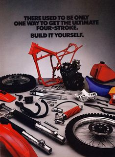 an advertisement for the honda motorcycle company with parts and tools on it's table