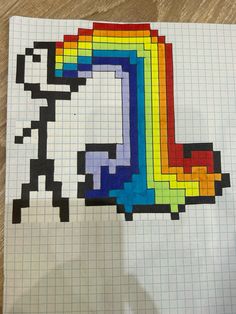 a piece of paper that has been made to look like a pixellated rainbow on it