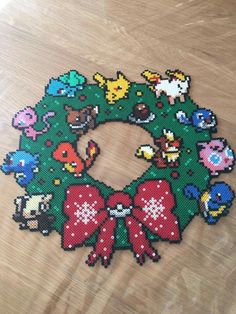 a christmas wreath made out of pixelated video game characters