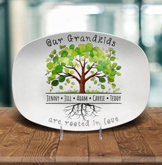 a white plate with a tree on it and the words our grandmas are rooted in love