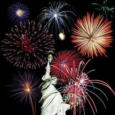 the statue of liberty surrounded by fireworks