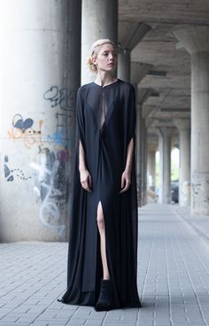 Every girl needs some drama in her life. The black cape dress is the ultimate... Black Cape Dress, Plunging Neckline Dress, Silk Cape, Crop Top With Jeans, Black Cape, Bespoke Fashion, Cape Dress, Black Maxi, Every Girl