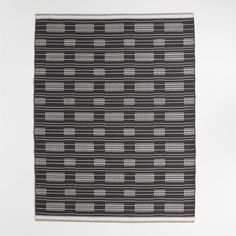 a black and white rug with lines on it