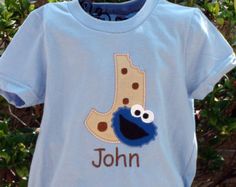 a blue shirt with an image of a cookie monster on it that says, john