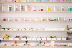 there are many craft supplies on the shelves