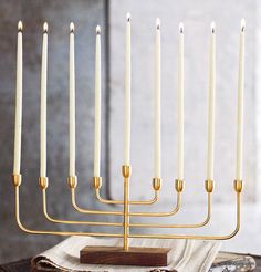 a hanukkah with seven candles on it sitting on top of a table