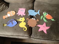 several sea animals cut out on the back of a couch