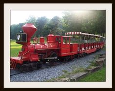 an old fashioned train is on the tracks