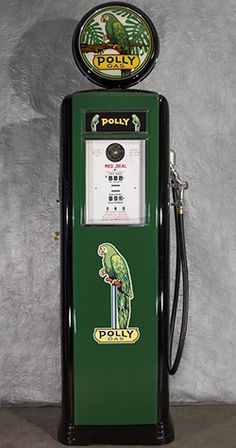 an old fashioned green and black gas pump with a sign on top that says poley