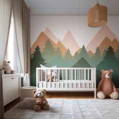 a baby's room with mountains painted on the wall and teddy bears in the crib