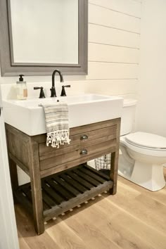 a bathroom with a sink, toilet and mirror on the wall next to an instagram page