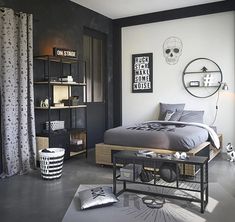 the bedroom is decorated in black and white