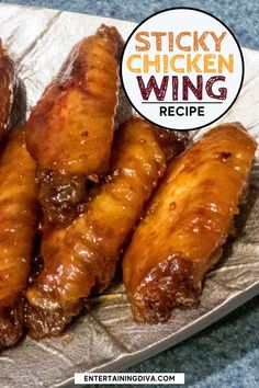 chicken wings are sitting on a plate with the words sticky chicken wing recipe above them