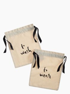 two bags with writing on them that say it was to wear and one has a black ribbon