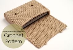 a crocheted wallet is shown on a white surface