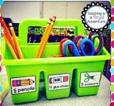 a green container filled with lots of school supplies