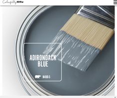 a paint can with a brush on it and the words adirondack blue