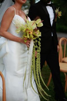 the bride and groom are standing outside together