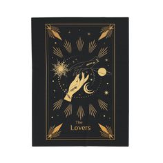 a black and gold tarot card with the words,'the lovers'on it