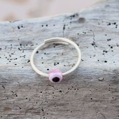 Pink eye, evil eye ring, open sterling silver ring 1.3 mm thick. Stackable ring. All our products are handmade in our little workshop with much care and love. You are welcome to send us a message if you have any questions! Best, Christina OPTION TO UPGRADE AT CHECKOUT WITH DHL Express FOR DELIVERY IN 3-5 DAYS Minimalist Adjustable Pink Stackable Rings, Handmade Pink Toe Ring Jewelry, Handmade Pink Toe Ring, Pink Adjustable Open Midi Ring, Pink Adjustable Sterling Silver Stackable Rings, Adjustable Pink Sterling Silver Stackable Rings, Pink Adjustable Toe Ring, Adjustable Pink Toe Ring, Handmade Pink Promise Ring