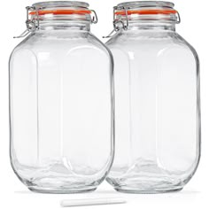 two large glass jars with lids on each one side and an orange lid in the middle