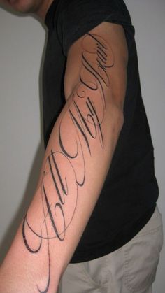 a man's arm with the word hello written on it in cursive writing