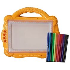 an orange plastic frame with colored pencils in front of it and a box of markers