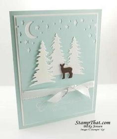 a card with a deer and trees on it