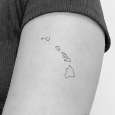 a woman's arm with a small map tattoo on the left side of her body