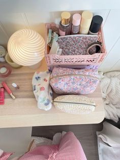 various items are sitting on a table in a room with white walls and wood flooring