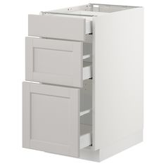 a white cabinet with two drawers and one door open to reveal the bottom part of the cabinet