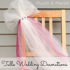 a chair with a pink and white tulle on it's back sitting in front of a house