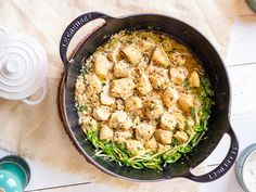 a pan filled with food sitting on top of a table