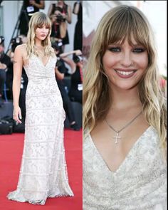 taylor swift at the 2009 venice international film festival wearing a white gown and diamond necklace