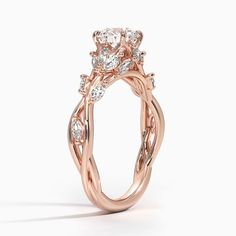 a rose gold ring with diamonds on it