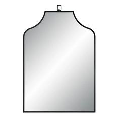 a mirror that is on top of a white wall with a black border around it