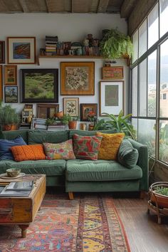 a living room filled with lots of furniture and pictures on the wall above it's windows