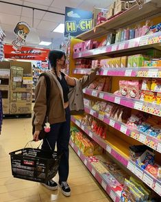 a woman is shopping in a grocery store