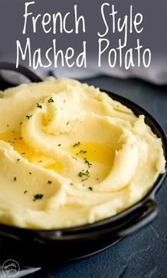 mashed potatoes in a black bowl with butter and parsley on top, text overlay reads french style mashed potato