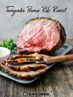 there is a large piece of meat on the plate next to some sauces and parsley