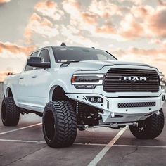 a white ram truck parked in a parking lot