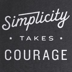 a black t - shirt with white lettering that says simplicity takes courage