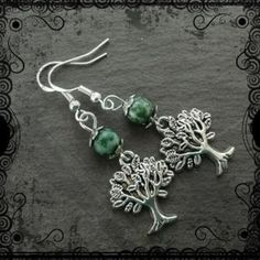 Tree earrings with tree agate   Please have a look at my other jewellery. There is a wide selection of bracelets, earrings and necklaces made with gems, crystals and glass or ceramic beads. I also offer hand blended perfume oils and a good range of supplies for magical people.   All my jewellery will arrive at your abode in a gift bag and well packaged for safety. Magical People, Dnd Druid, Gems Crystals, Tree Agate, Tree Earrings, Beads Earrings, Earring Tree, Ceramic Beads, Perfume Oils