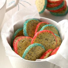 a bowl filled with cookies on top of a table