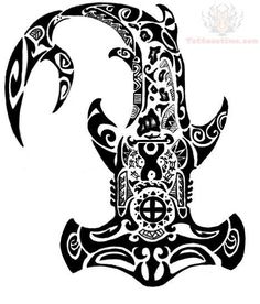 an intricately designed letter k in the shape of a bird with ornate designs on it