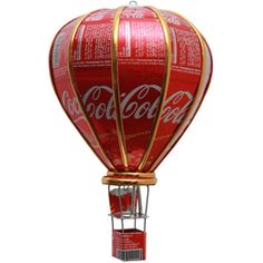 a red hot air balloon with coca cola on it