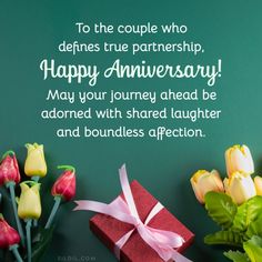 some flowers and a red box with a pink ribbon on it that says to the couple who defies true parenship, happy anniversary may your journey ahead be adored with shared laughter and bound